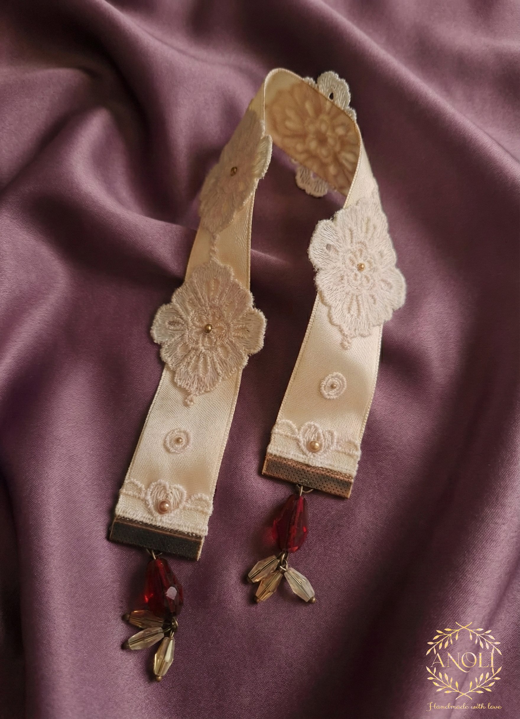 Pink bookmark on fabric